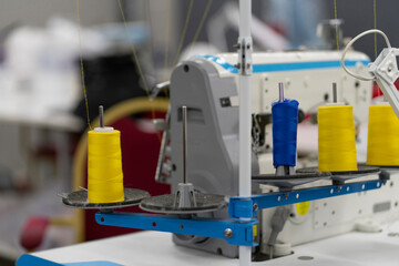 inside of the textile manufatory, modern industrial sewing equipment