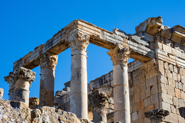Low-angle view of Roman columns against the sky in the ancient Roman town of Djemila, Setif,...