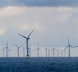 Offshore and Onshore Windmill farm Westermeerwind, Windmill park in the Netherlands with huge large...