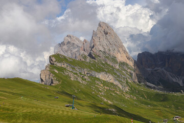 Naklejka premium Panorama on Seceda, forcella Pana and the Odles mountains in Trentino Alto Adige, Dolomites Alps, South Tyrol, Val Gardena, Italy
