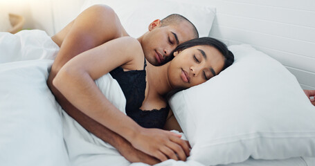 Couple, hugging and sleeping in bed, love and resting or comfortable at home on weekend. People,...