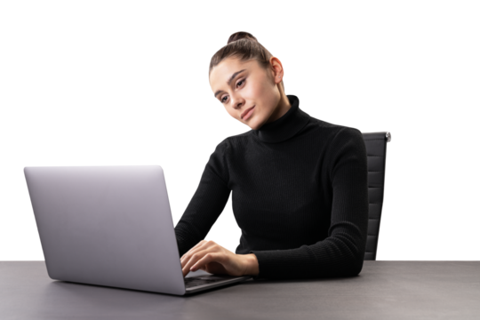 Attentive businesswoman using laptop, focused on screen, modern workplace