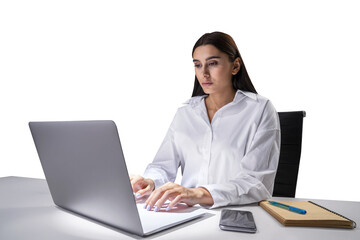 Concentrated young professional typing on laptop, organized desk in office setting