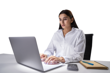 Concentrated young professional typing on laptop, organized desk in office setting