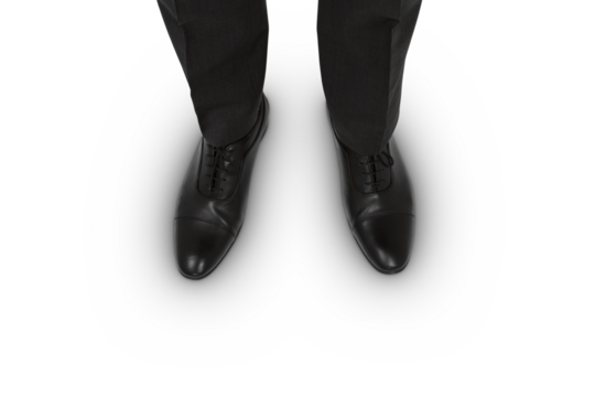 Top view of businessman's black shoes on white surface, corporate attire