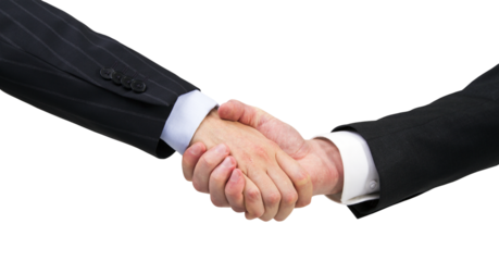 Two professionals in suits engaging in a handshake, signifying a successful agreement