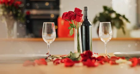 Fotobehang Eetkamer Wine, glass and romance on valentines day for celebration of love, anniversary or honeymoon in still life. Flowers, dinner and elegant date in dining room of home for event, milestone or occasion  © Felix/peopleimages.com