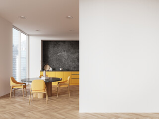 White and yellow kitchen interior with dining table and blank wall