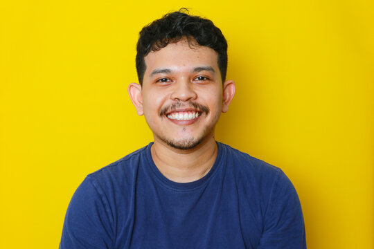 a potrait of asian young man smiling isolated, studio shoot. advertising concept.