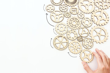 Hand spinning gears on a white background