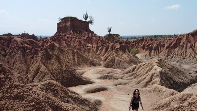 Girl walking on the Tatacoa Desert, famous place in Colombia, South America.