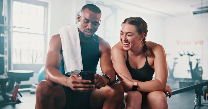 Gym friends, phone and happy people talking about fitness information, sports and man show exercise to partner. Smartphone, relax and athlete team check online social media post of training challenge