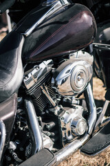 Close up of the engine of a vintage custom motorcycle. Selective focus.
