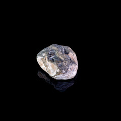 Fototapeta premium Mineral stone on a black background close-up