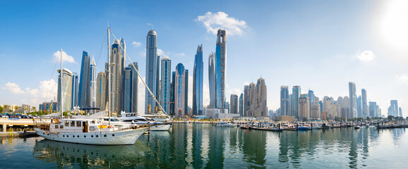 Dubai marina harbor panorama on a sunny day in the UAE - obrazy, fototapety, plakaty
