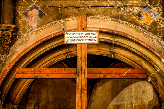 Saint-Germain-l'Auxerrois catholic church, Paris, France. Cross with INRI sign in Hebrew, Greek and Latin (Iesus Nazarenus Rex Ludeorum)