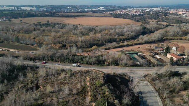 Traffic drives towards bifurcation in road near Olesa de Montserrat, Barcelona