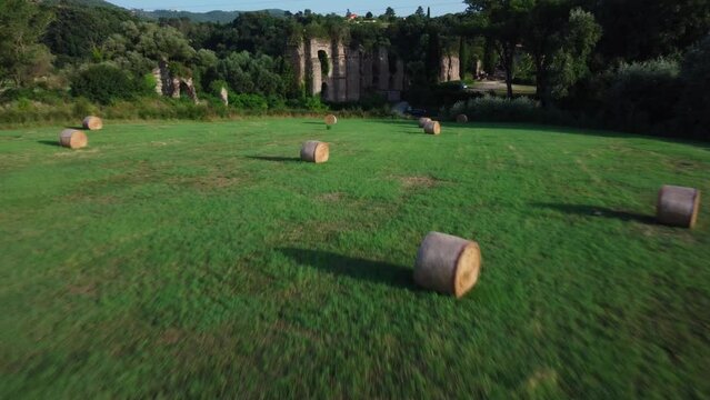 Drone approaches ruins of Ponte Lupo, ancient Roman aqueduct in Lazio, Italy