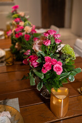 Beautiful tables served for a dinner with flowers and candles. interior decorations, festive, holidays, celebration, restaurant