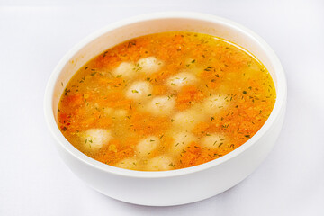 soup with meatballs on white background