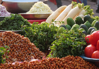 Fresh local vegetable market displaying ingredients for Asian or Indian food.