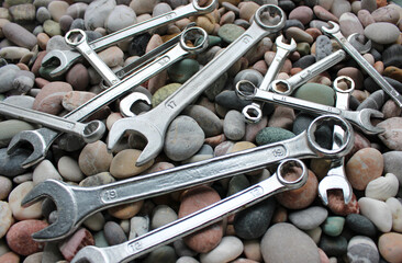 Ring End And Open End Wrenches On A Pebbles Angle View 
