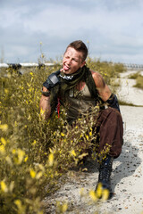 portrait of a male vandal in dirty clothes