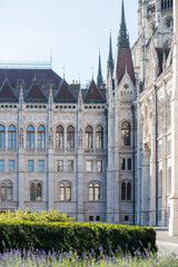 Fototapeta na wymiar Corner of a building with an unusual stylish facade. Inner courtyard of the European Parliament in Budapest. Hungarian Parliament. Stylish Gothic building.