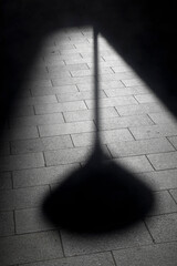 Shadow of a lamp post in Paris, France
