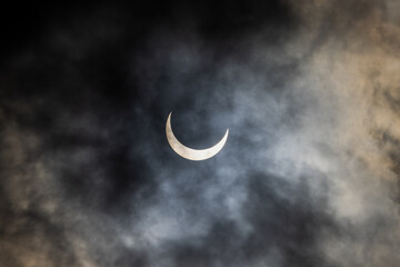 Partial phase of the annular solar eclipse covered in clouds, San Antonio, Texas USA