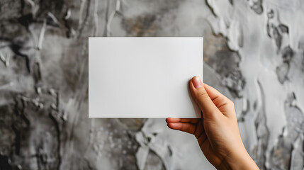 Minimalistic aesthetic hand holding showing blank white empty paper note with copy space for text ad advertising , business announcement promotion concept