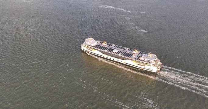 Ferry ship Texelstroom between Den Helder and Texel in the Netherlands. Passenger ferry ship. Sustainable solar panels on the deck.