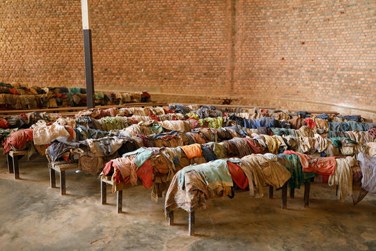 Nyamata Genocide Memorial Center, Nyamata, Rwanda. Victims' clothes on church pews