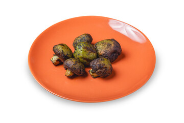 Grilled mushrooms in a plate. Isolated.