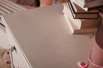 Close-up of a beige wooden dresser, showcasing its smooth surface and simple design.
