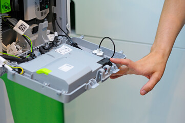 Man fitter assembling modern house gas boiler