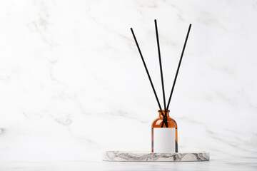 Aroma diffuser, spa background, reed sticks for diffusion, calming atmosphere