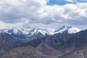 Wide shot landscape view of a mountain range with majestic peaks