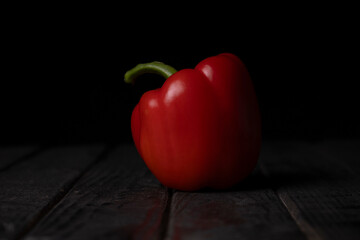 Red pepper on a black background