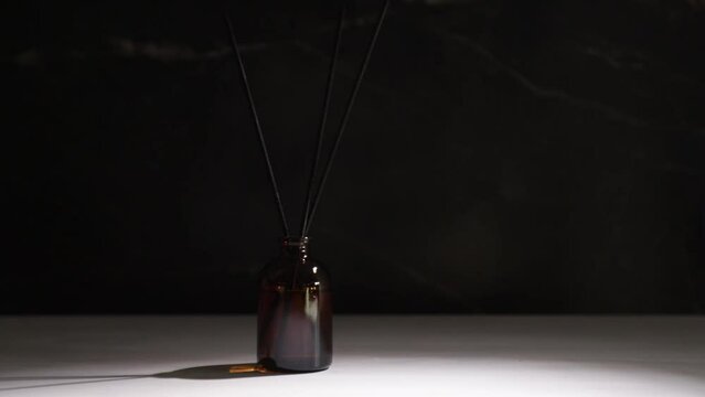 Aroma diffuser on marble background with smoke, essential oil scent, cozy spa ambiance, relaxation therapy