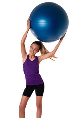 Slim and fit teen girl holding a swiss blue ball with arms up. Shot on white background.