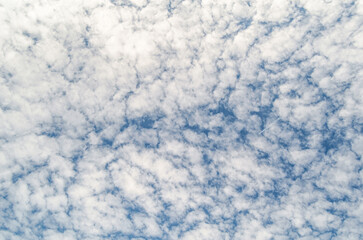 Clouds over blue sky background