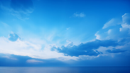 Ocean, sky and blue clouds on the horizon