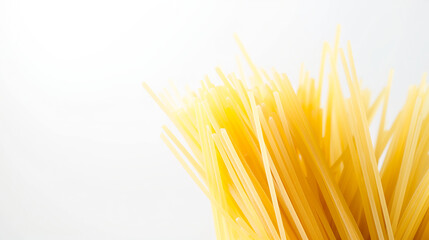 Raw spaghetti noodles arranged neatly in a bowl