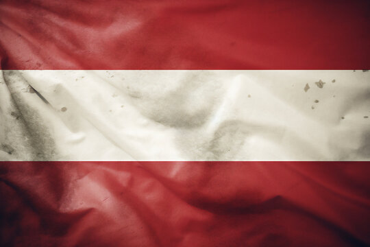 Flag of Austria background with a distressed vintage weathered effect showing the Austrian red and white triband colours, stock illustration image