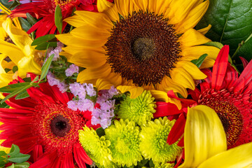 Bright flower bouquet with sunflowers. Nature background.