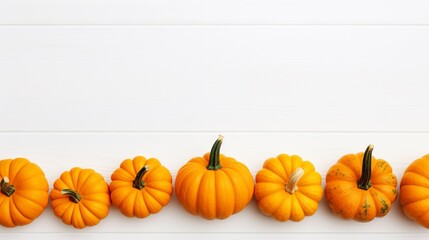 Small decorative pumpkins on white wooden background. Autumn, fall, thanksgiving or halloween day concept, flat lay, top view,