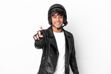 Young man with a motorcycle helmet isolated on white background showing and lifting a finger