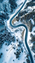 Aerial view of the winding Snake Road in winter in the Dolomite Alps of Italy