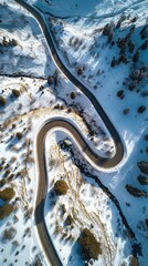 Aerial view of the winding Snake Road in winter in the Dolomite Alps of Italy
